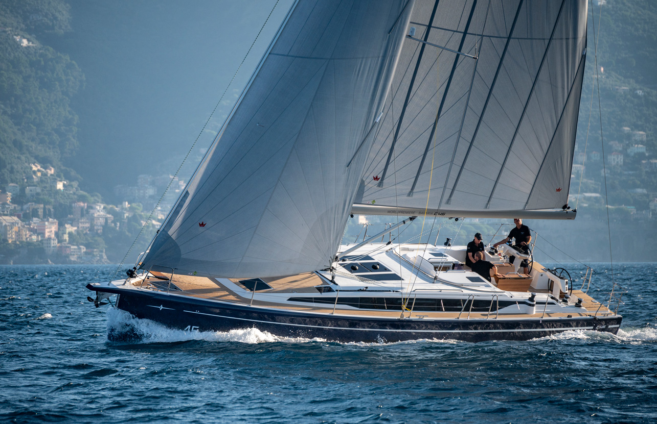 Bavaria C46 sailing yacht cruising under sail along the coast