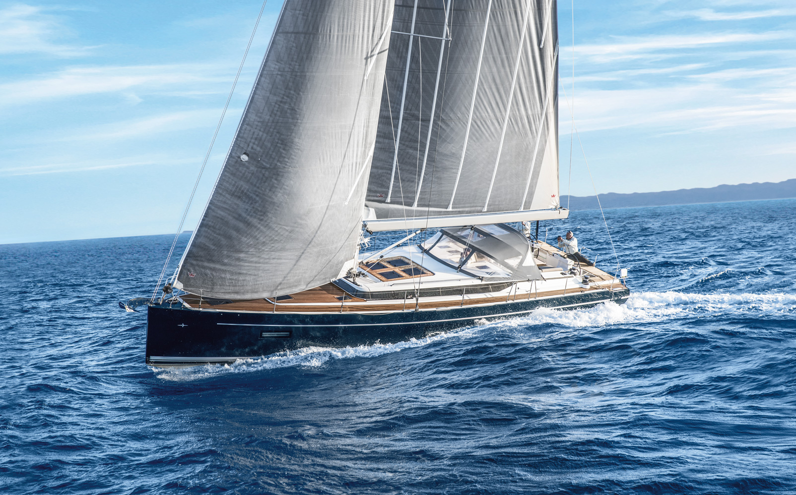 Bavaria C57 sailing yacht cruising under sail at sea