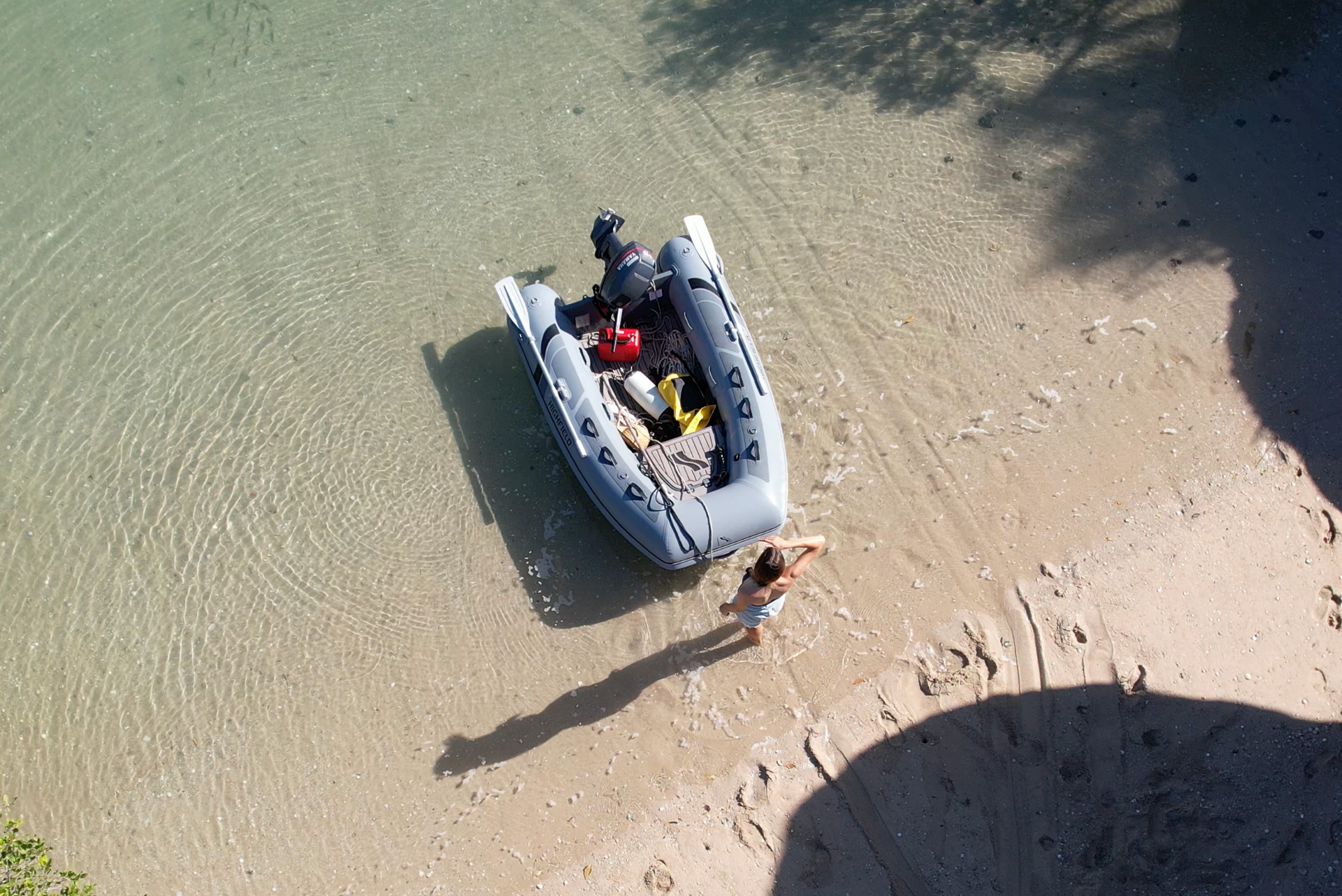 Highfield CL260 inflatable tender viewed from above in shallow coastal water