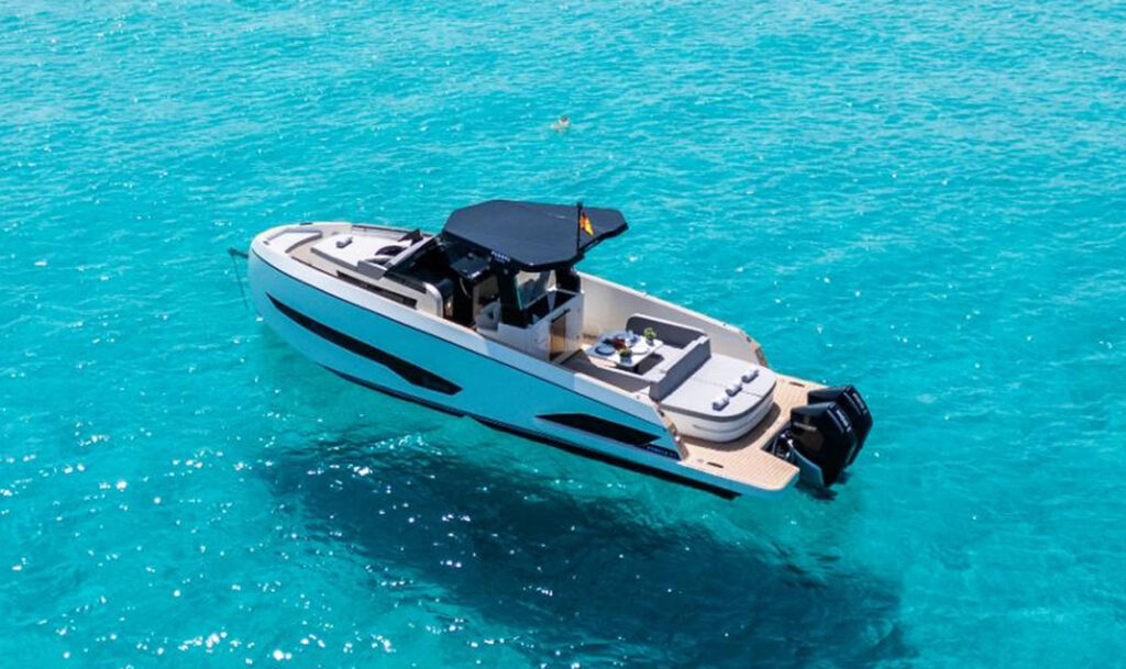 Aerial view of the Kumbra 34 cruising through turquoise water