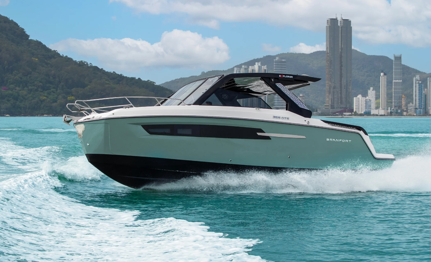 Granfort 355 GTS Explorer motor yacht cruising on the water, showcasing its modern hull design and hardtop.