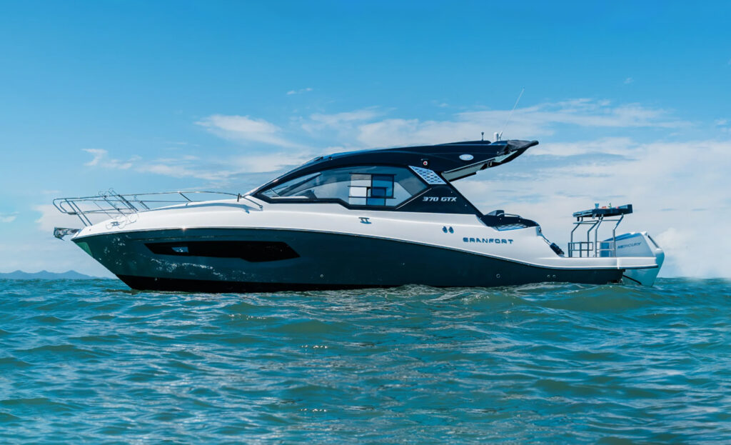 Side profile of the Granfort 370 GTX motor yacht showcasing its sporty hull design and contemporary hardtop.