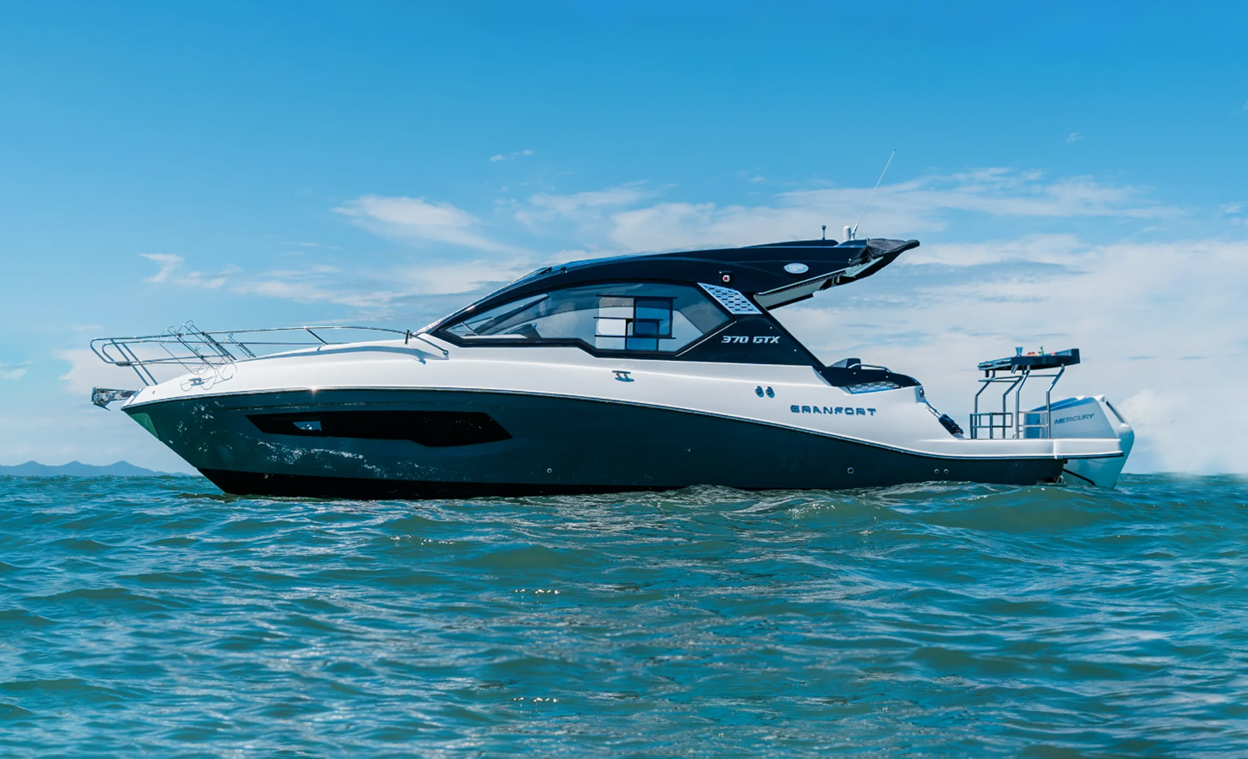 Side profile of the Granfort 370 GTX motor yacht showcasing its sporty hull design and contemporary hardtop.