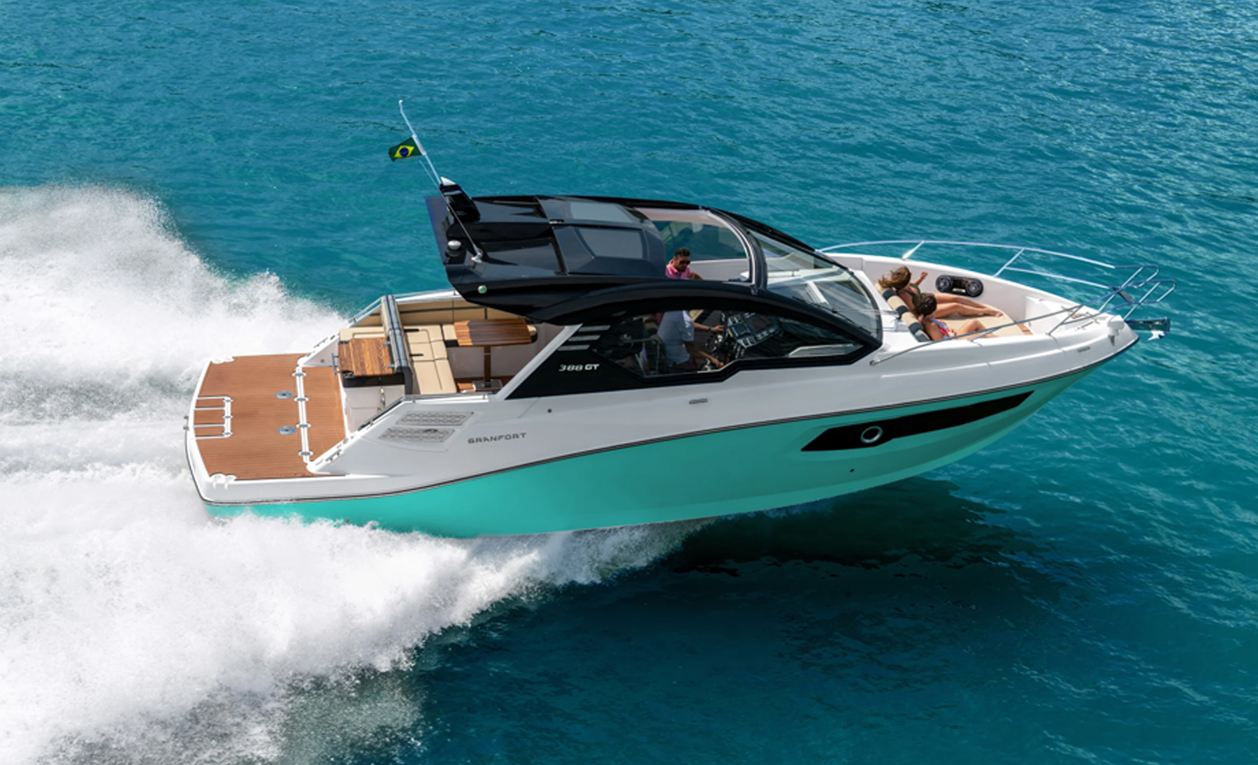 Granfort 388 GT motor yacht cruising on the water, showcasing its contemporary hardtop, sleek hull and spacious stern platform.
