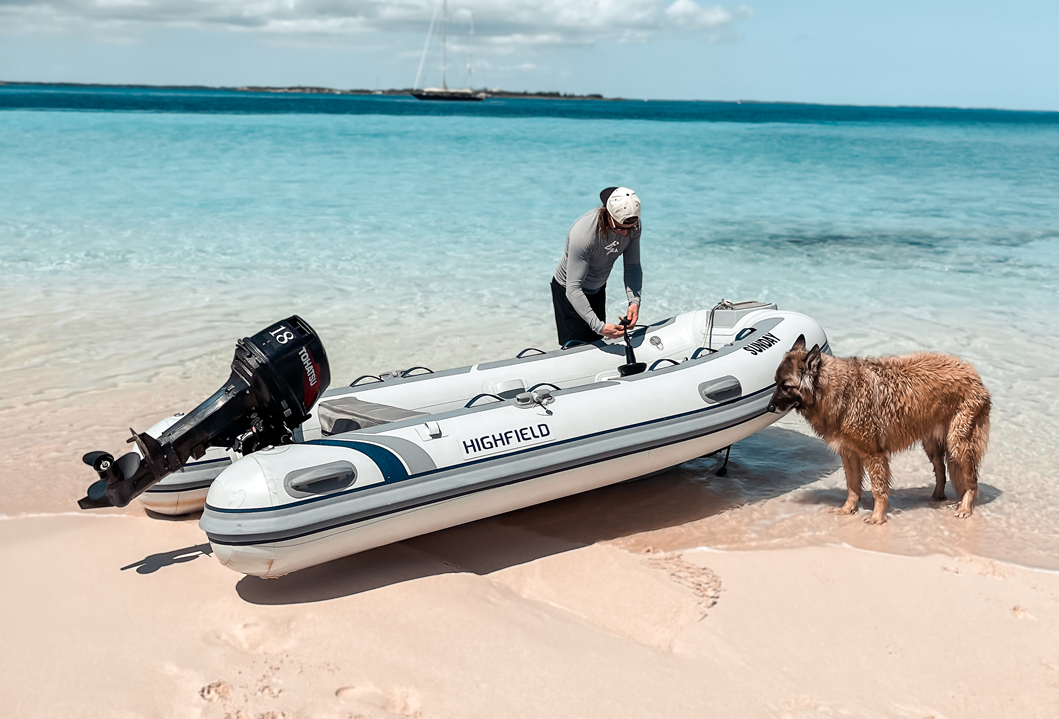 Highfield CL340 aluminium RIB tender pulled ashore on the beach