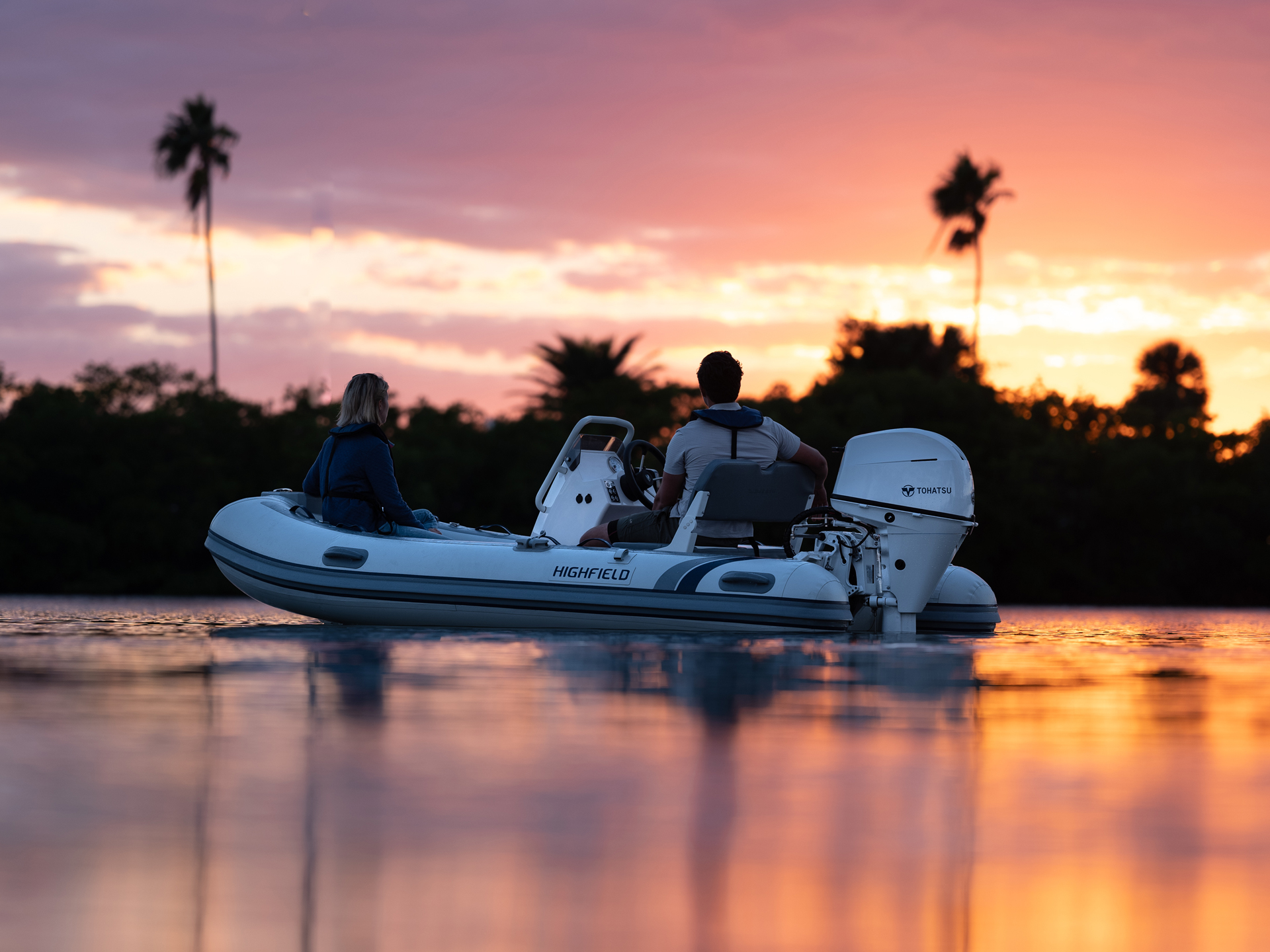 Highfield CL380 aluminium RIB cruising at sunset with passengers onboard