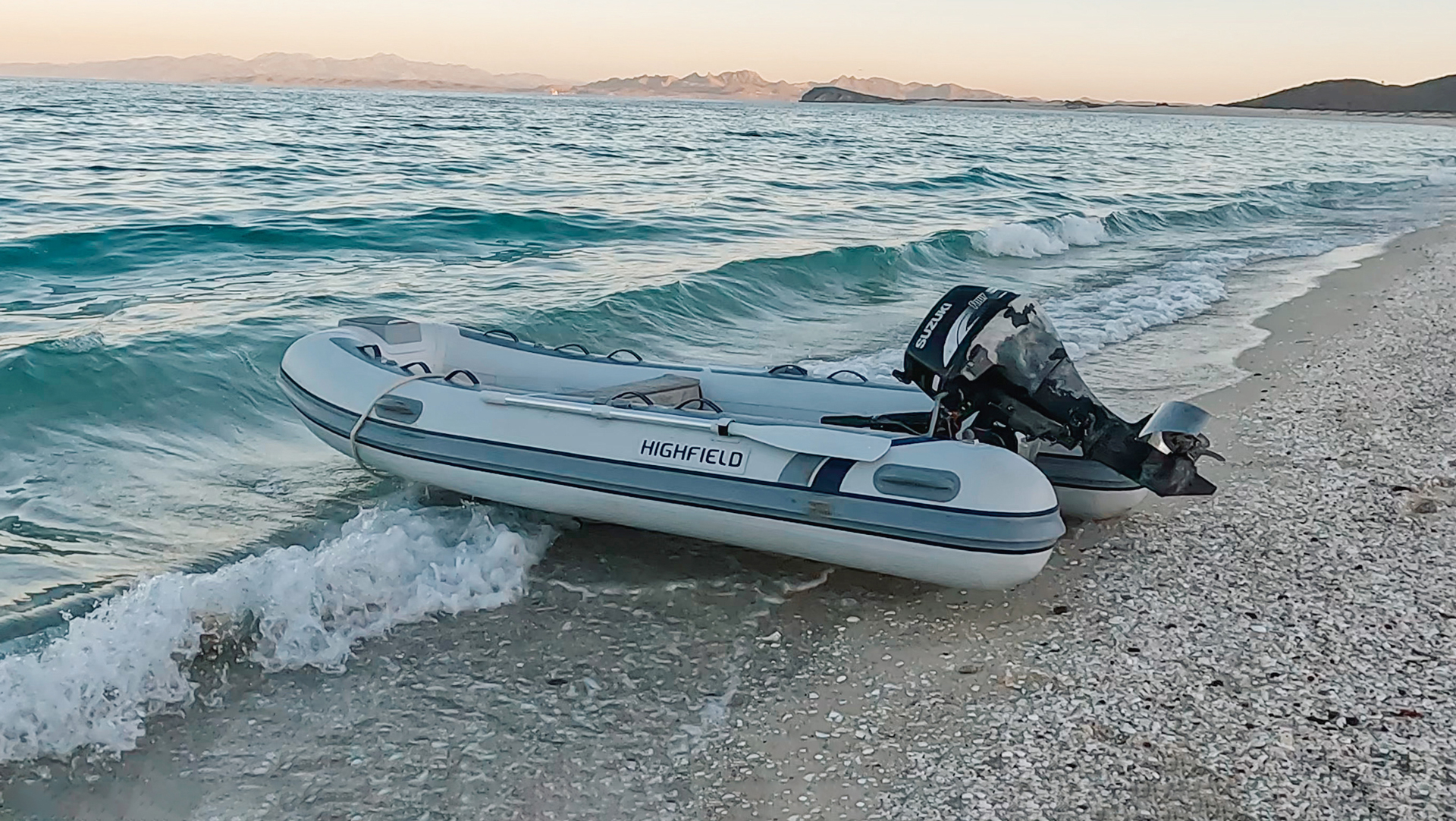 Highfield CL360 aluminium RIB viewed from the side on the water