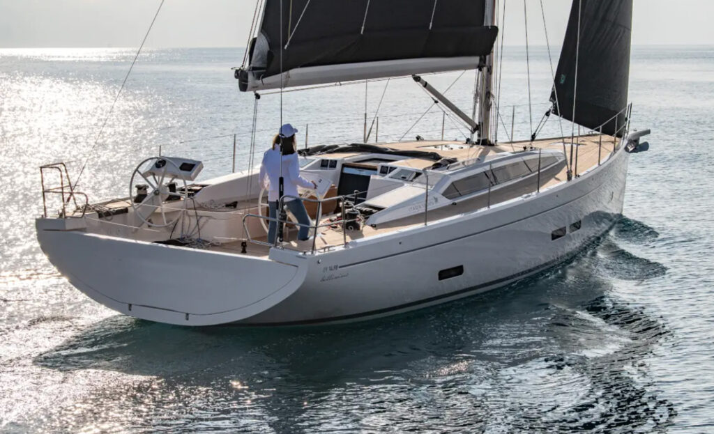 Rear view of the Italia Yachts IY 14.98 Bellissima showing the cockpit, twin steering wheels and sailing equipment.