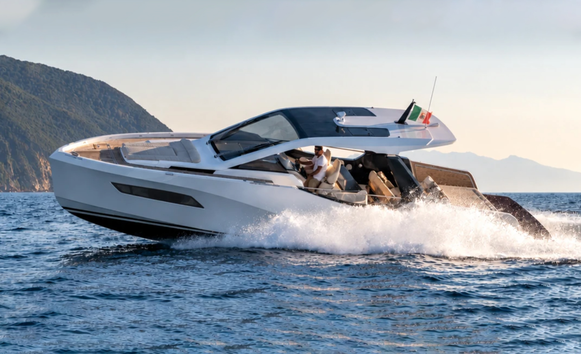 Side view of the Italia Yachts IY 43 Veloce cruising at speed, highlighting its elegant hull and contemporary design.