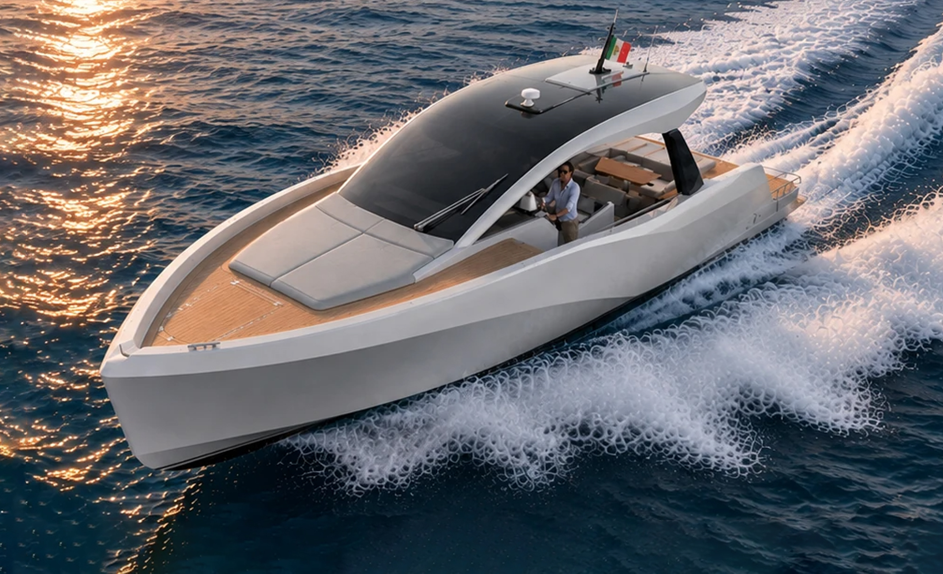 Aerial view of the Italia Yachts IY 46 Veloce cruising at sea, highlighting its sleek hull, T-top and spacious deck layout.