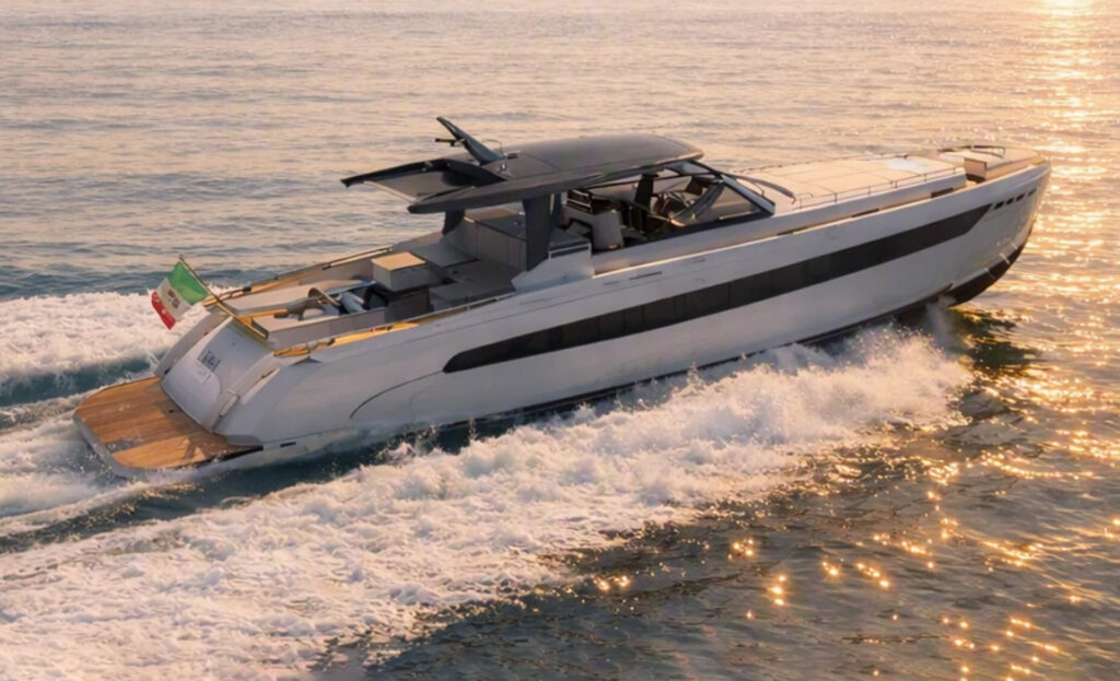Aerial side view of the Italia Yachts IY 65 Veloce cruising at sea, showcasing its sleek hull, T-top design and spacious exterior layout.