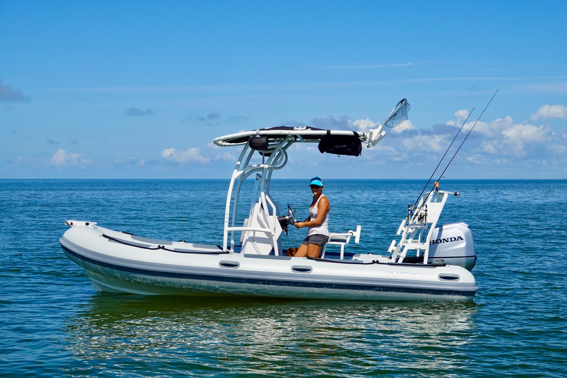 Highfield PA540 Patrol RIB with T-top cruising on clear blue water