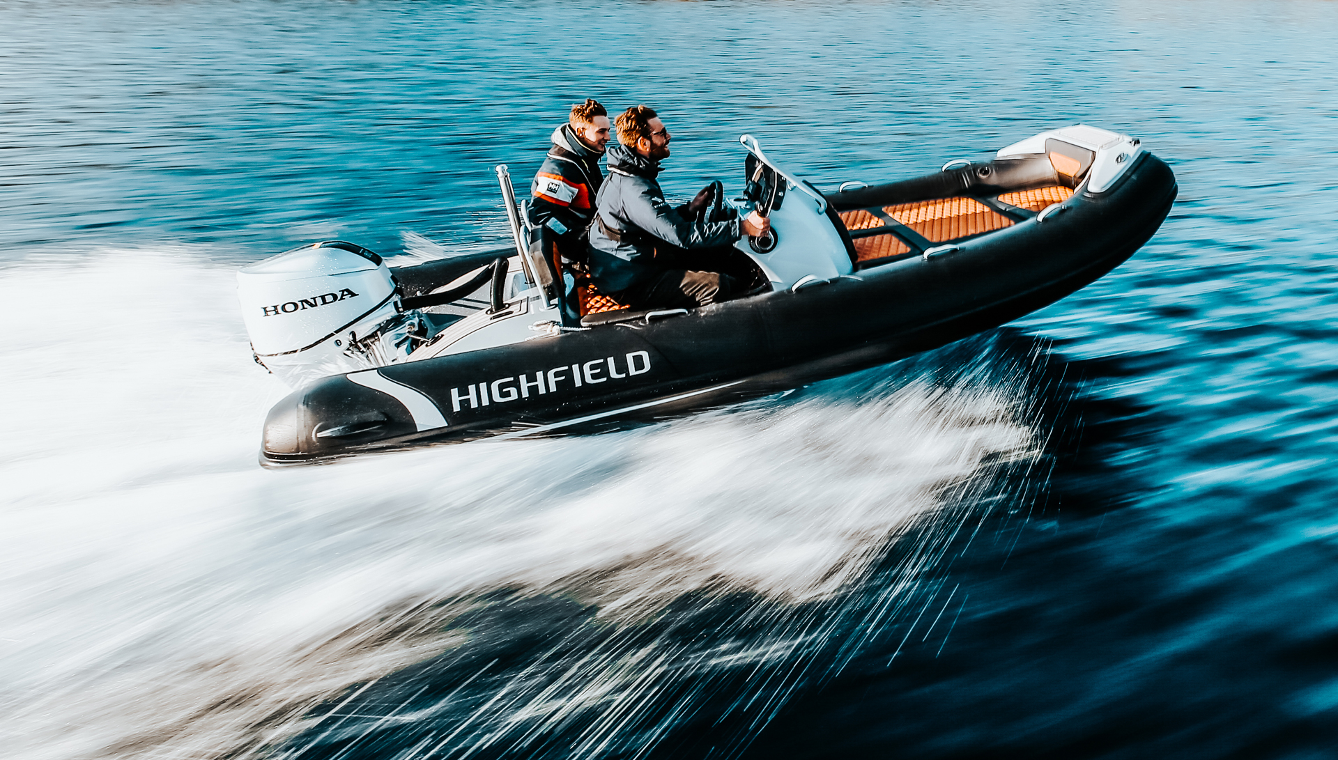 Highfield SP460 Sport RIB cruising at speed with passengers onboard