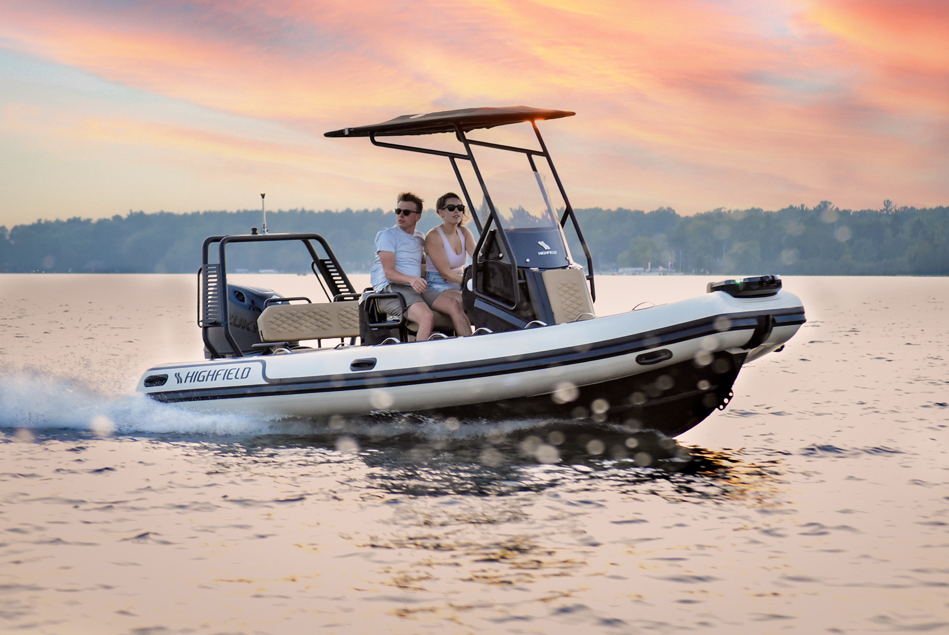 Highfield SP560 Sport RIB cruising with passengers at sunset