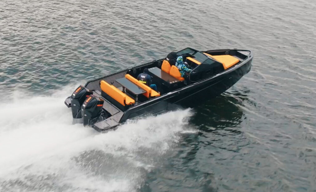 Elevated view of the Virtue V33 Open underway, showcasing its open deck arrangement, seating areas and modern design.