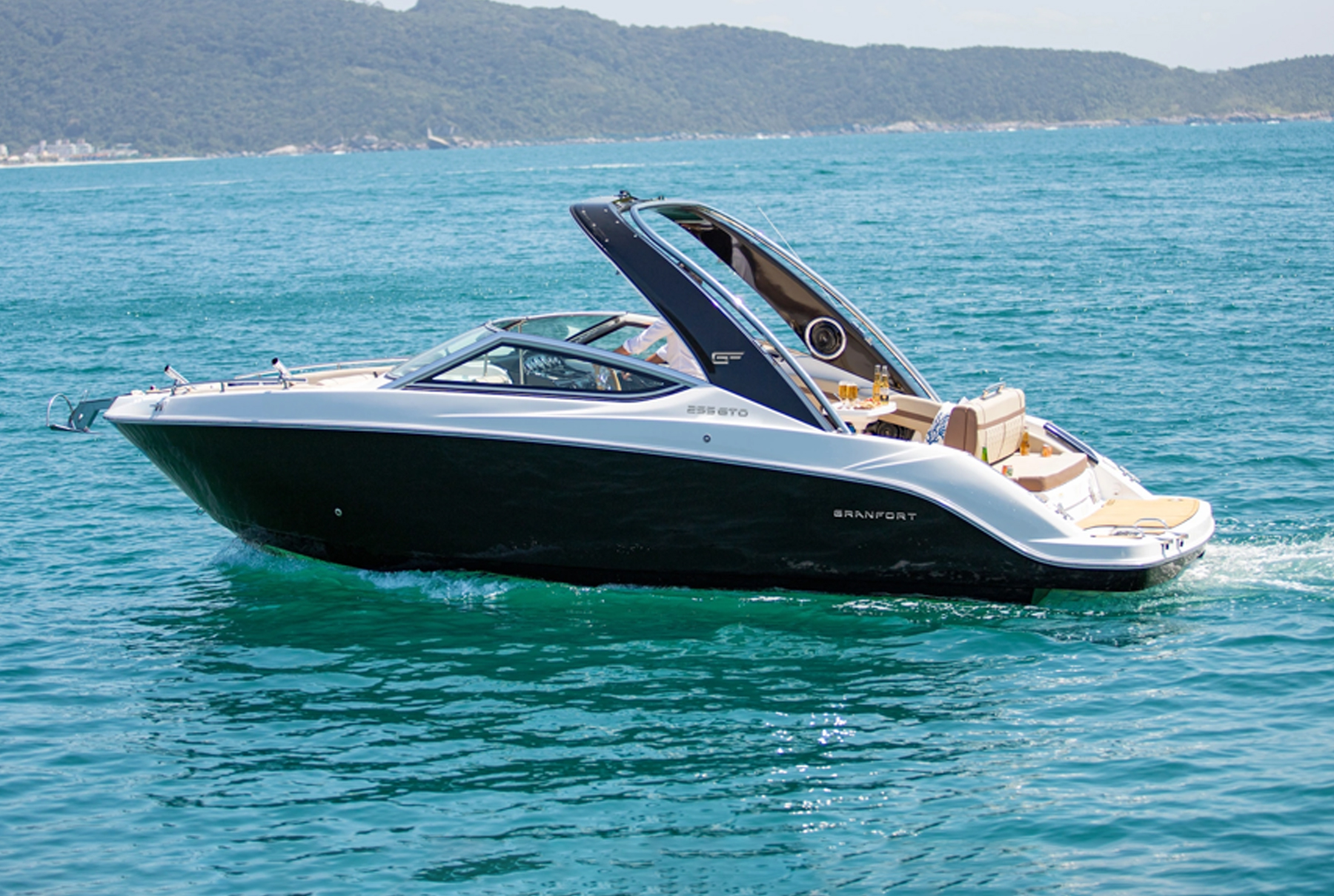 Rear three-quarter view of the Granfort 255 GTO with black hull and aft sunpad