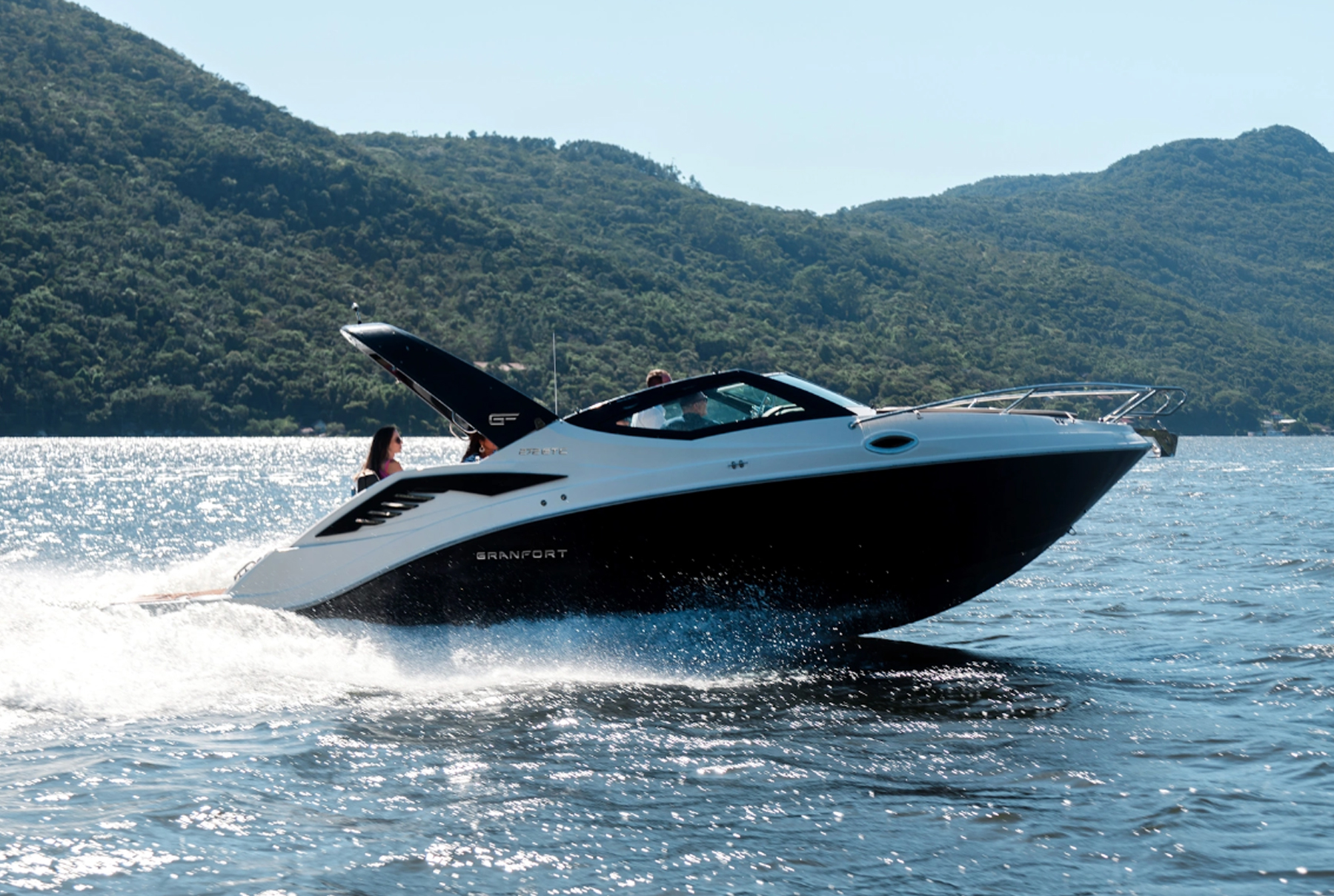 Granfort 272 GTC black and white sport cruiser cruising near the coastline