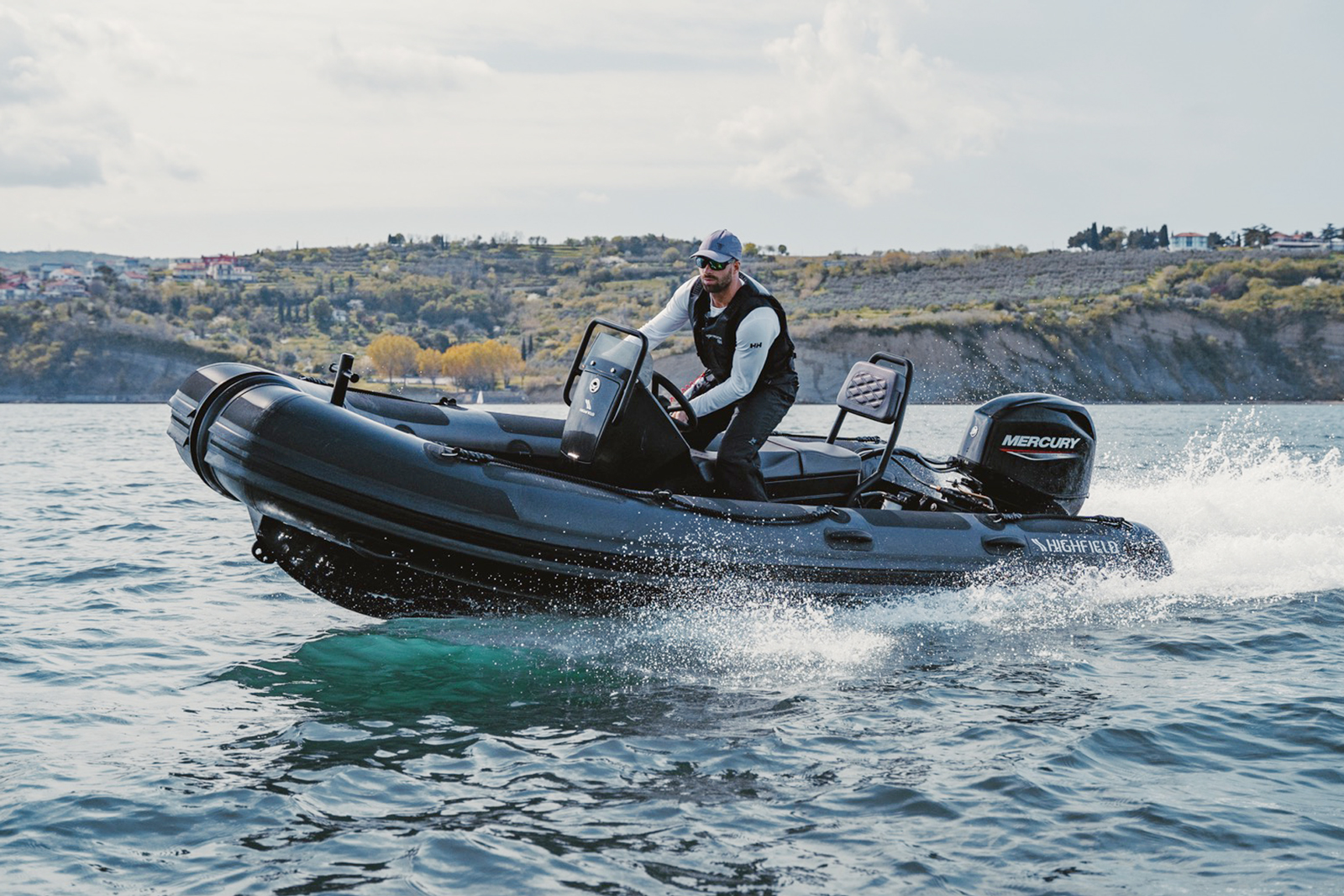 Highfield PA460 Patrol RIB underway with centre console and passengers