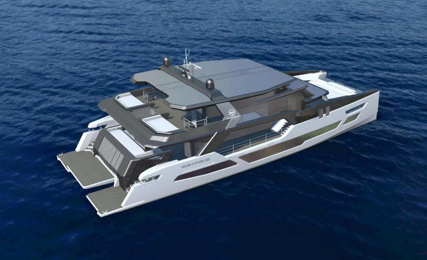 Aerial view of the Sunpower Stealth Solar-E-Hydro 137 highlighting its distinctive multihull design, expansive decks and integrated solar roof.