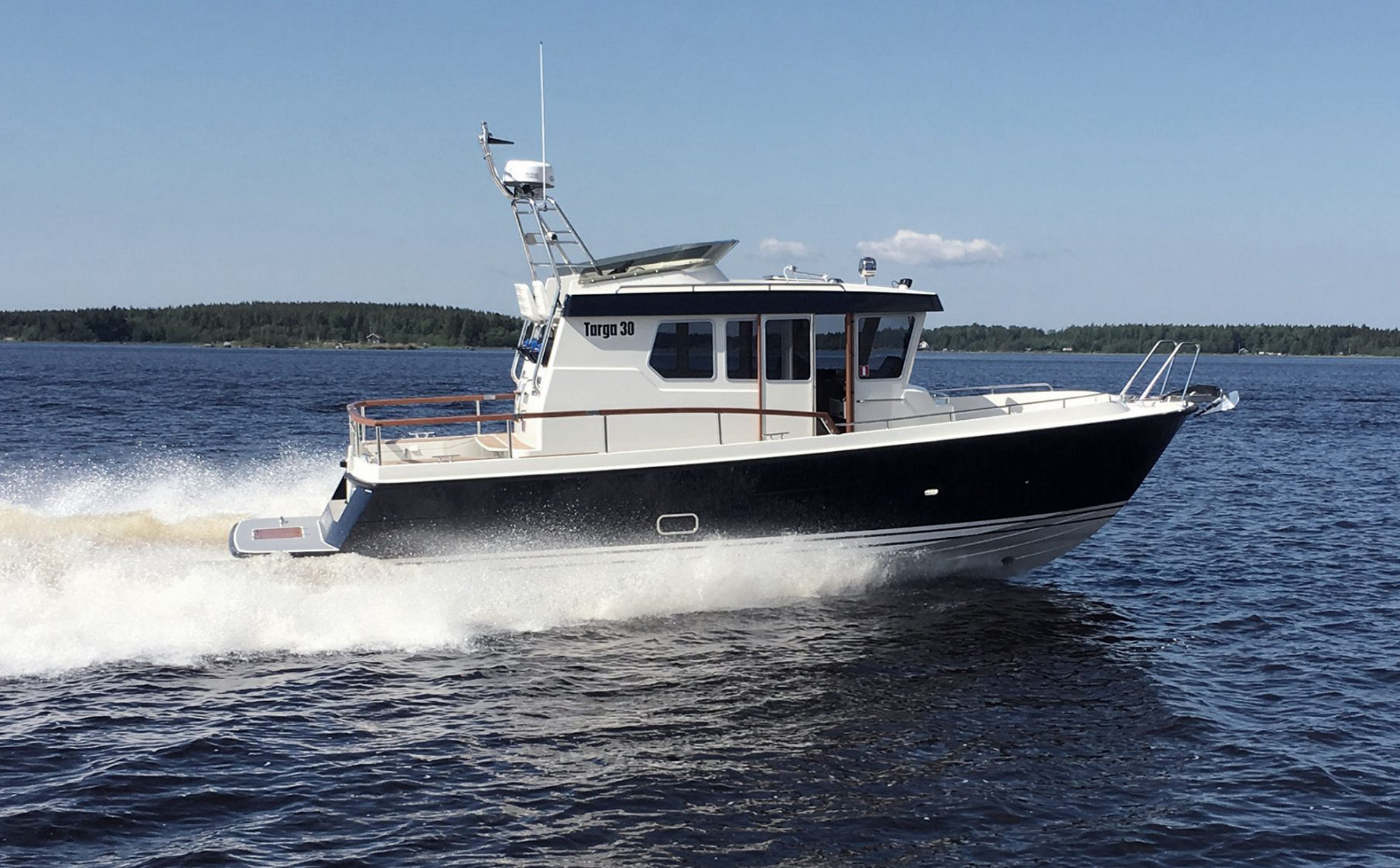 Targa 30.1 pilothouse motor boat cruising at speed
