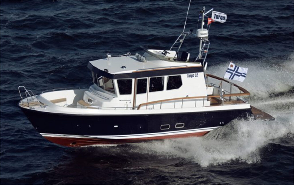 Targa 32 pilothouse motor boat cruising at speed